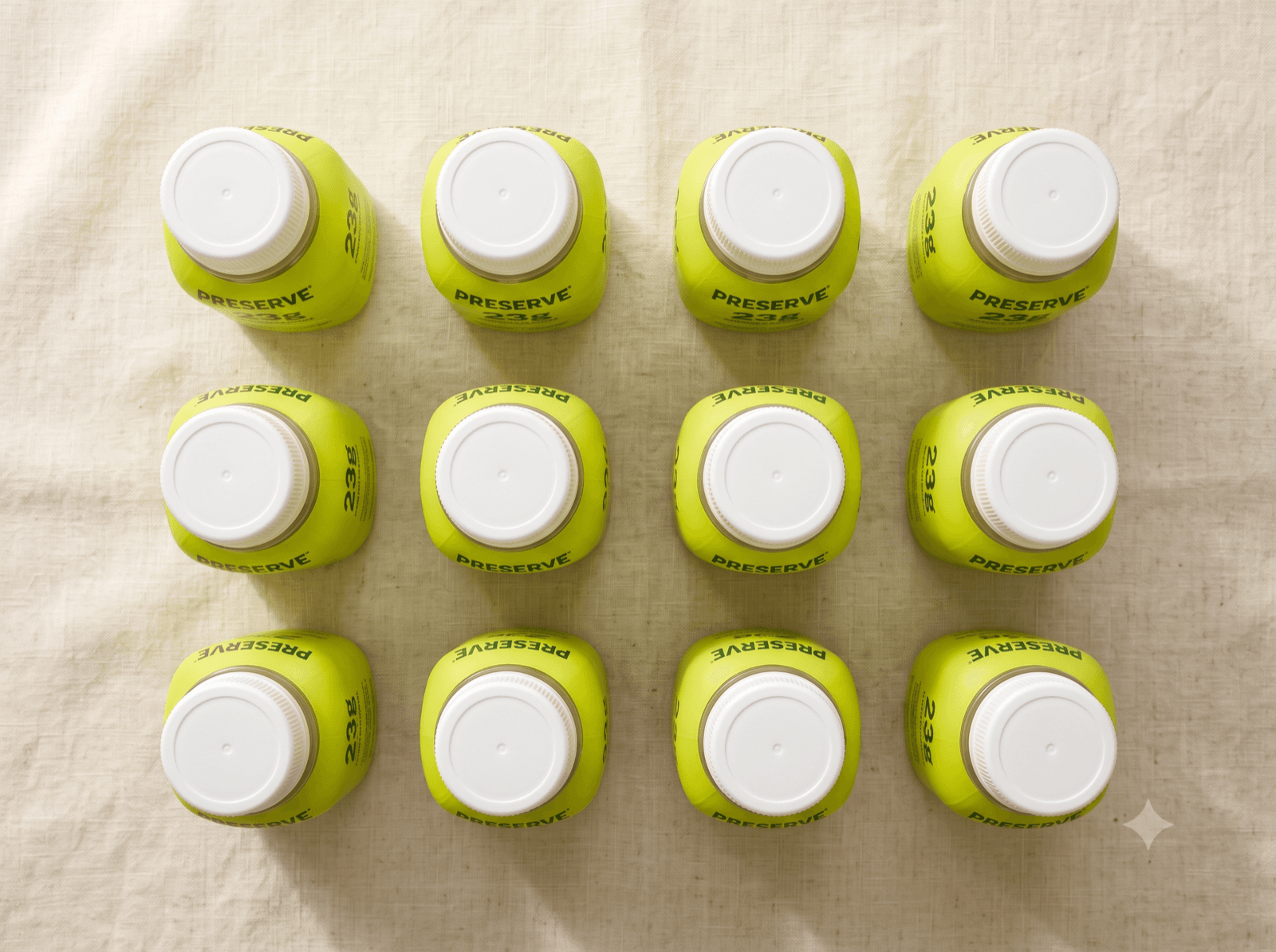 A 12-pack of Preserve bottles arranged flat on a table